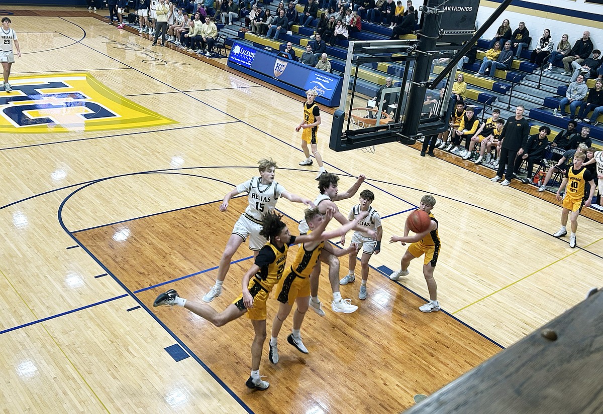 Helias boys basketball vaults to 15-0 lead in win vs. Monroe City ...