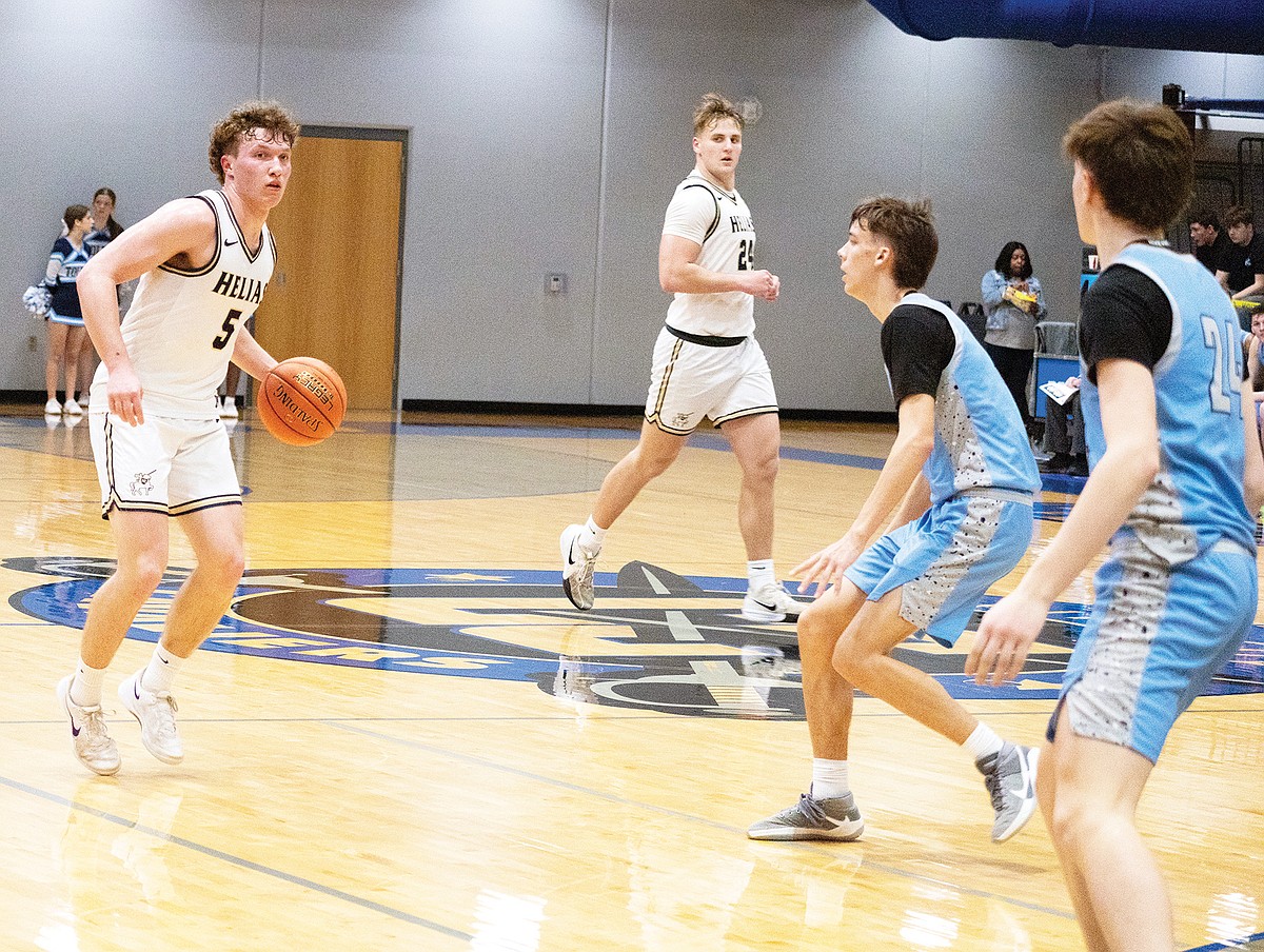 Helias boys basketball cruises past Father Tolton in district ...