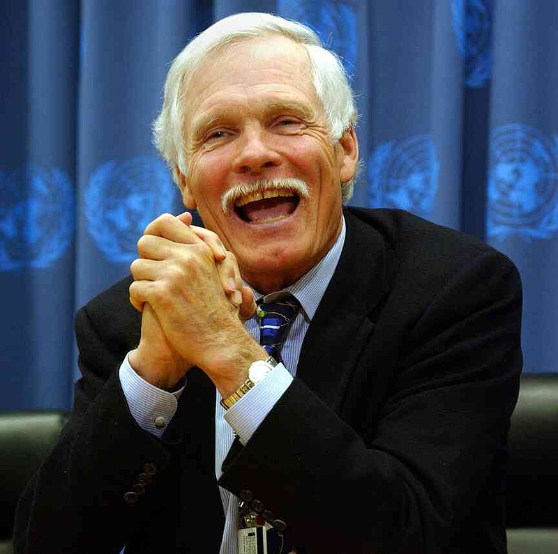 Ted Turner, philanthropist and Chairman of the Board of Directors of the United Nations (UN) Foundation, gestures as he speaks at UN headquarters Dec. 10, 2002, in New York City. Turner was appearing at the UN to celebrate the five year anniversary of his $1 billion pledge to support the UN Foundation.  (Spencer Platt/Getty Images/TNS)