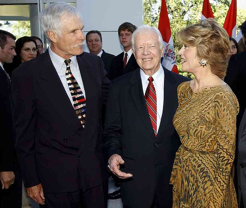 CNN founder Ted Turner, left, meets with former President Jimmy Carter and his ex-wife Jane Fonda at UNICEF Stars for Little Stars Gala Benefit on May 12, 2003, in Atlanta.   (Erik S. Lesser/Getty Images/TNS)