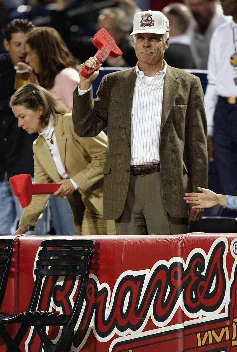 Former Atlanta Braves owner Ted Turner stands in the front row with a foam tomahawk during Game 1 of the National League Divisional Series against the Chicago Cubs on Sept. 30, 2003, at Turner Field in Atlanta.  (Craig Jones/Getty Images/TNS)