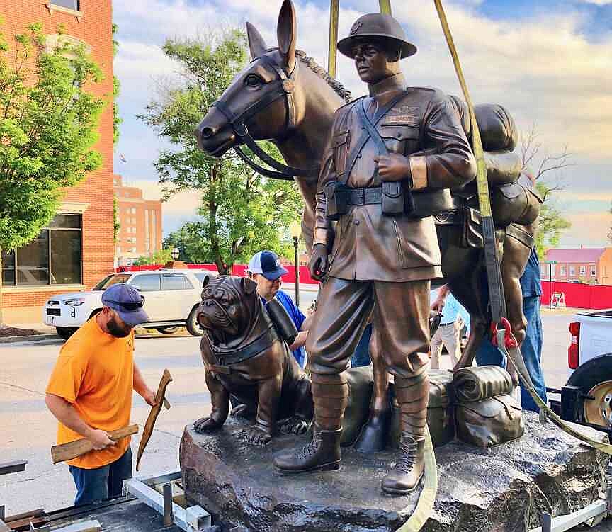 Workers gathered to unload a Missouri mule early Tuesday morning in front of the Cole County Courthouse.