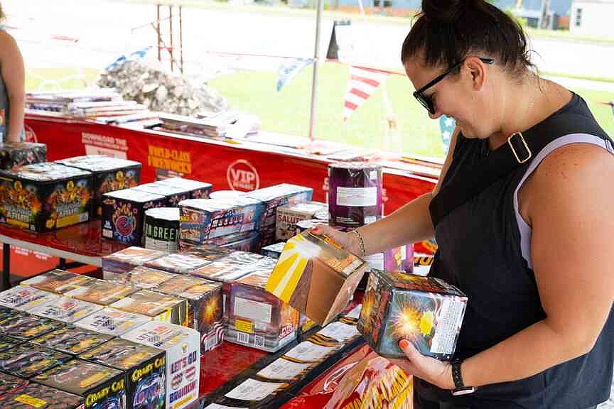 Customers shop for final fireworks after holiday seeking sales