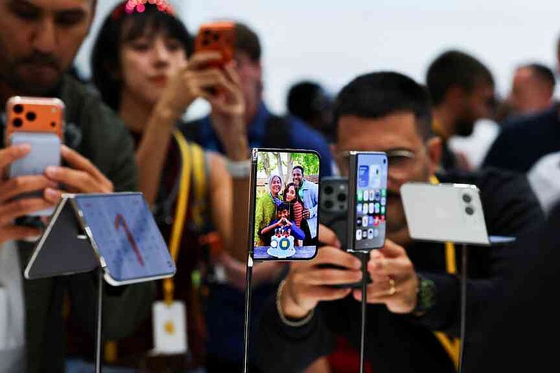 apple-joins-foldable-phone-race-with-1-999-passport-shaped-iphone-duo