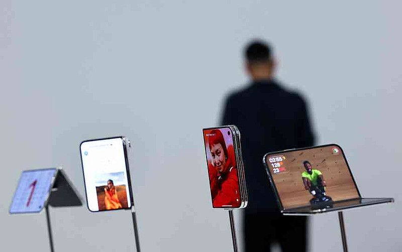 apple-joins-foldable-phone-race-with-1-999-passport-shaped-iphone-duo